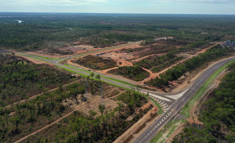 Alt text: Aerial view of Middle Arm Precinct showing road network, site access and early-stage development works 